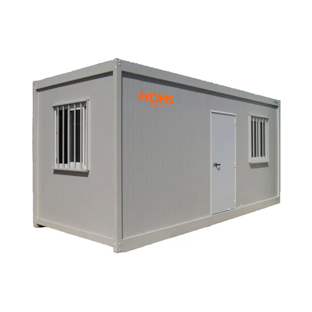 Grey portable container building with a door and two barred windows; HOMS Rentals logo on the side (used as a small office or storage unit)